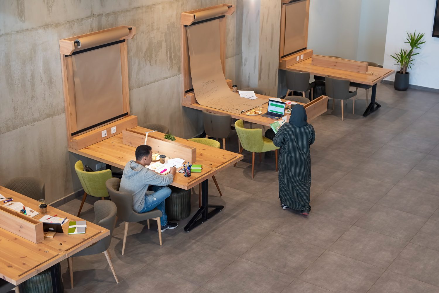 Open coworking workspace with members focused